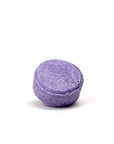 A purple round lavender chamomile shampoo bar