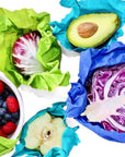Five multi-coloured etee sustainable beeswax food wraps wrapping fruits and vegetables