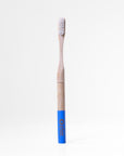 Bamboo toothbrush with blue handle