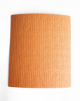 A orange cellulose cloth (reusable paper towel)