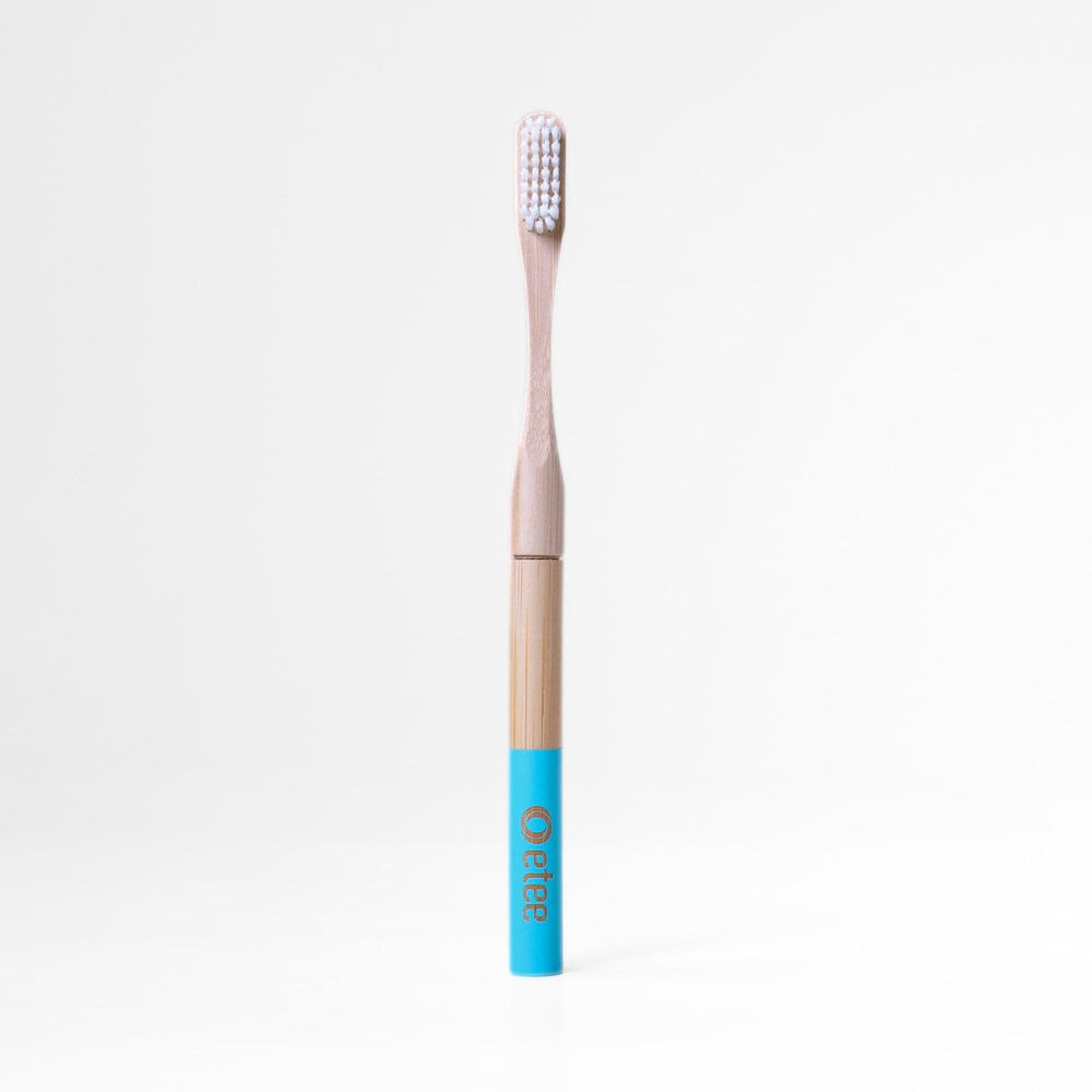Bamboo toothbrush with teal handle