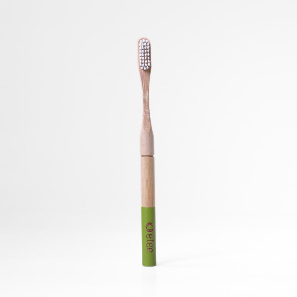 Bamboo toothbrush with green handle