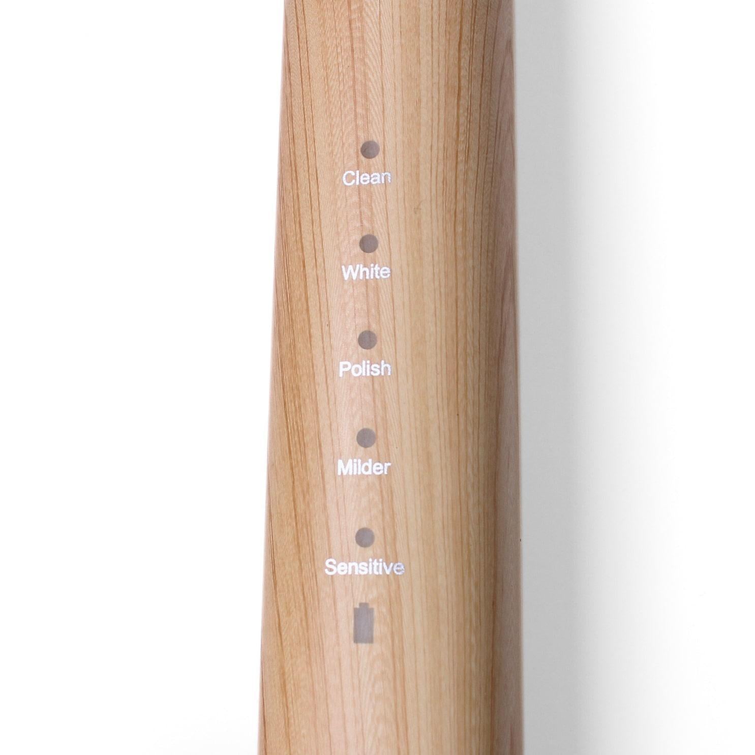 etee electric toothbrush with replaceable bamboo head closeup of toothbrush body with settings: &quot;clean, white, polish, milder, sensitive&quot;
