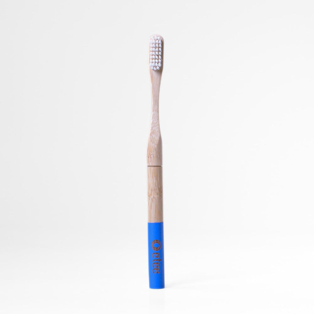 Bamboo toothbrush with blue handle