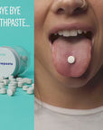 Young woman with an etee chewpaste tablet on her tongue. the text reads "bye bye toothpaste"
